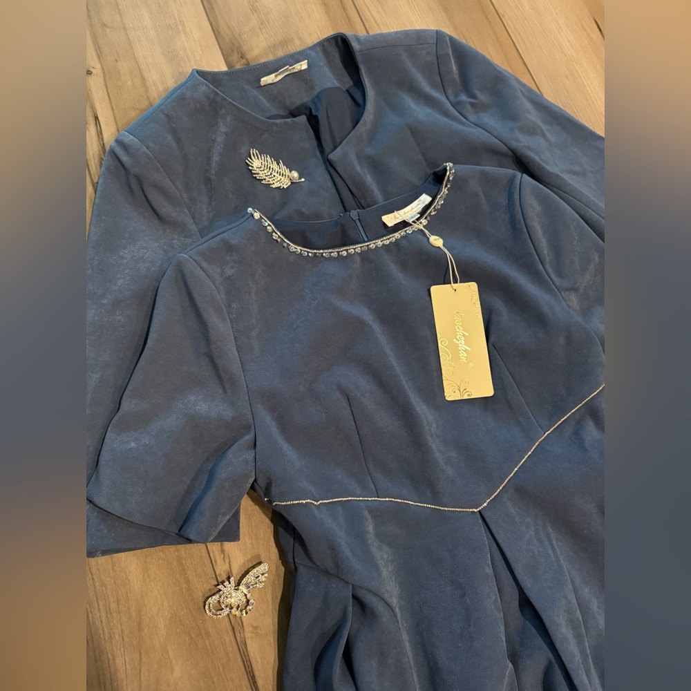 Elegant Blue Dress with Embellished Neckline and Matching Blazer and Broaches